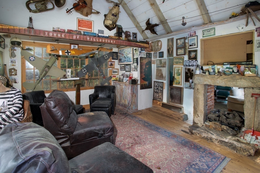 17 Quail Trail Westport, MA 02790 - Photo 30 of 40 a living room with lots of furniture and a flat screen tv
