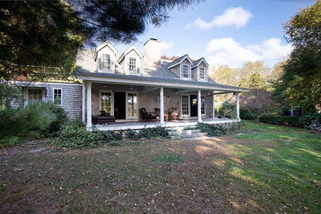 17 Quail Trail Westport, MA 02790 - Photo 5 of 40 a view of a house with a yard and sitting area