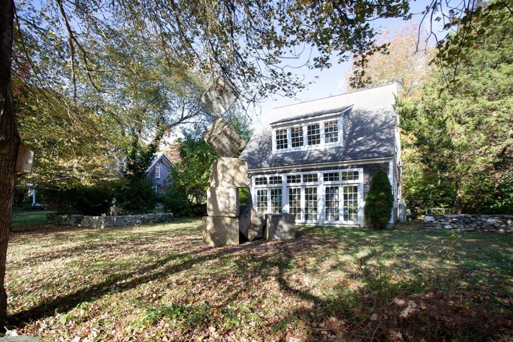 17 Quail Trail Westport, MA 02790 - Photo 9 of 40 a front view of a house with a yard