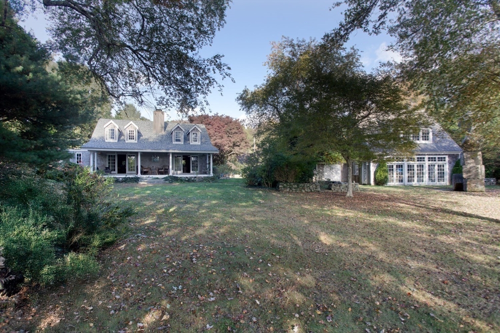 17 Quail Trail Westport, MA 02790 - Photo 10 of 40 a front view of a house with a garden