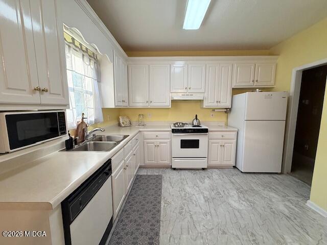 135 Chadwick Trail Macon, GA 31210 - Photo 7 of 22 a kitchen with a refrigerator a stove top oven a refrigerator and white cabinets with wooden floor