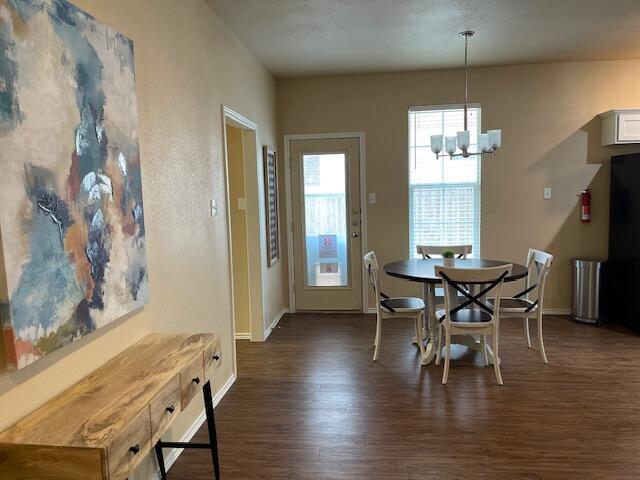 2116 10th Street Lubbock, TX 79401 - Photo 20 of 22 a view of a dining room with furniture and wooden floor