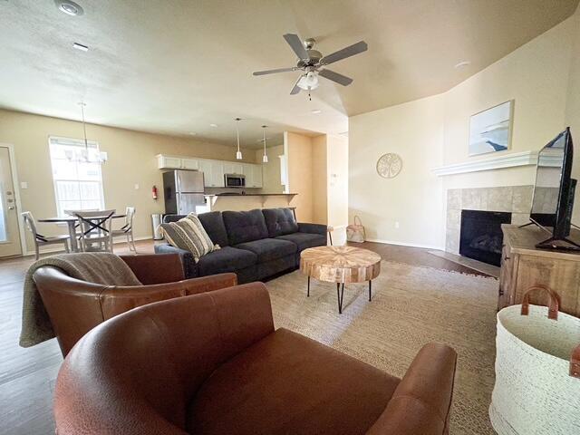 2116 10th Street Lubbock, TX 79401 - Photo 2 of 22 a living room with furniture and a fireplace