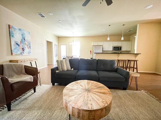 2116 10th Street Lubbock, TX 79401 - Photo 4 of 22 a living room with furniture and a large window