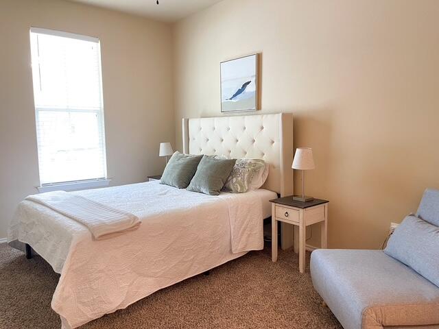 2116 10th Street Lubbock, TX 79401 - Photo 10 of 22 a bedroom with a bed and a window