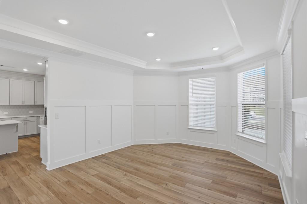 293 Deer Valley Run Canton, GA 30115 - Photo 6 of 8 an empty room with wooden floor and windows