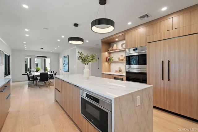 a kitchen with a sink stainless steel appliances and cabinets