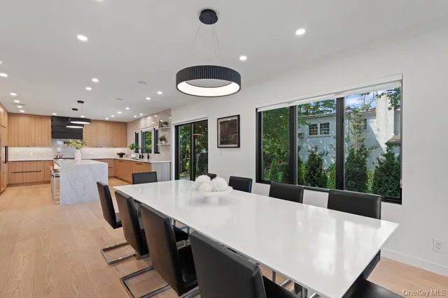a kitchen with a table chairs and a refrigerator