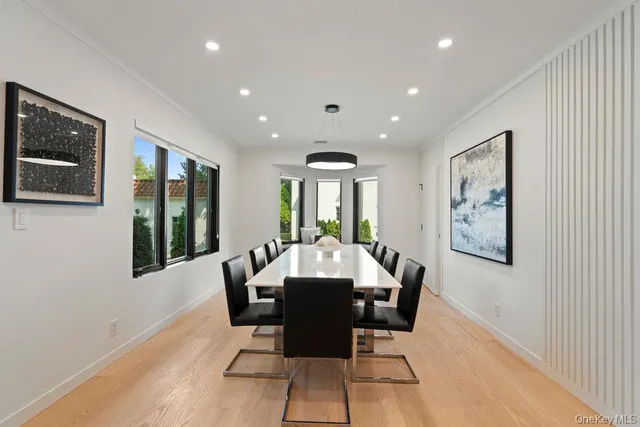 a view of a dining room with furniture window and wooden floor