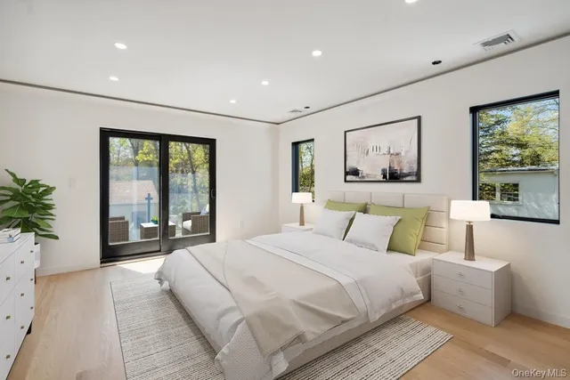 a bathroom with a double vanity sink mirror and shower