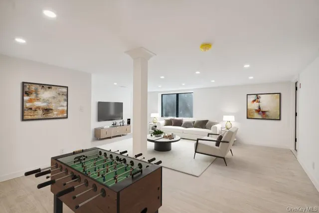 a bathroom with a sink a toilet a mirror and shower