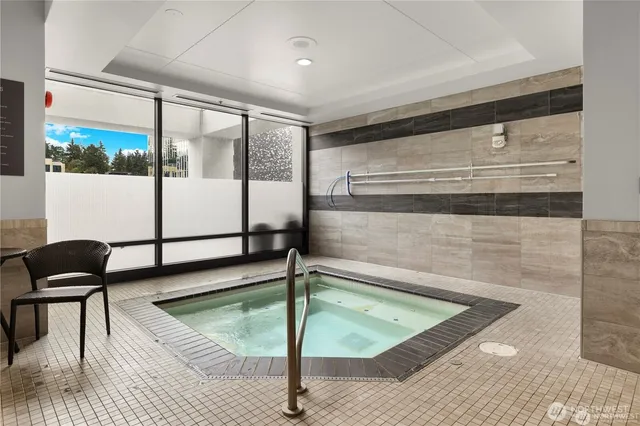 a view of a living room and floor to ceiling window or kitchen