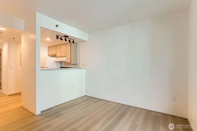 a view of a kitchen cabinets and wooden floor