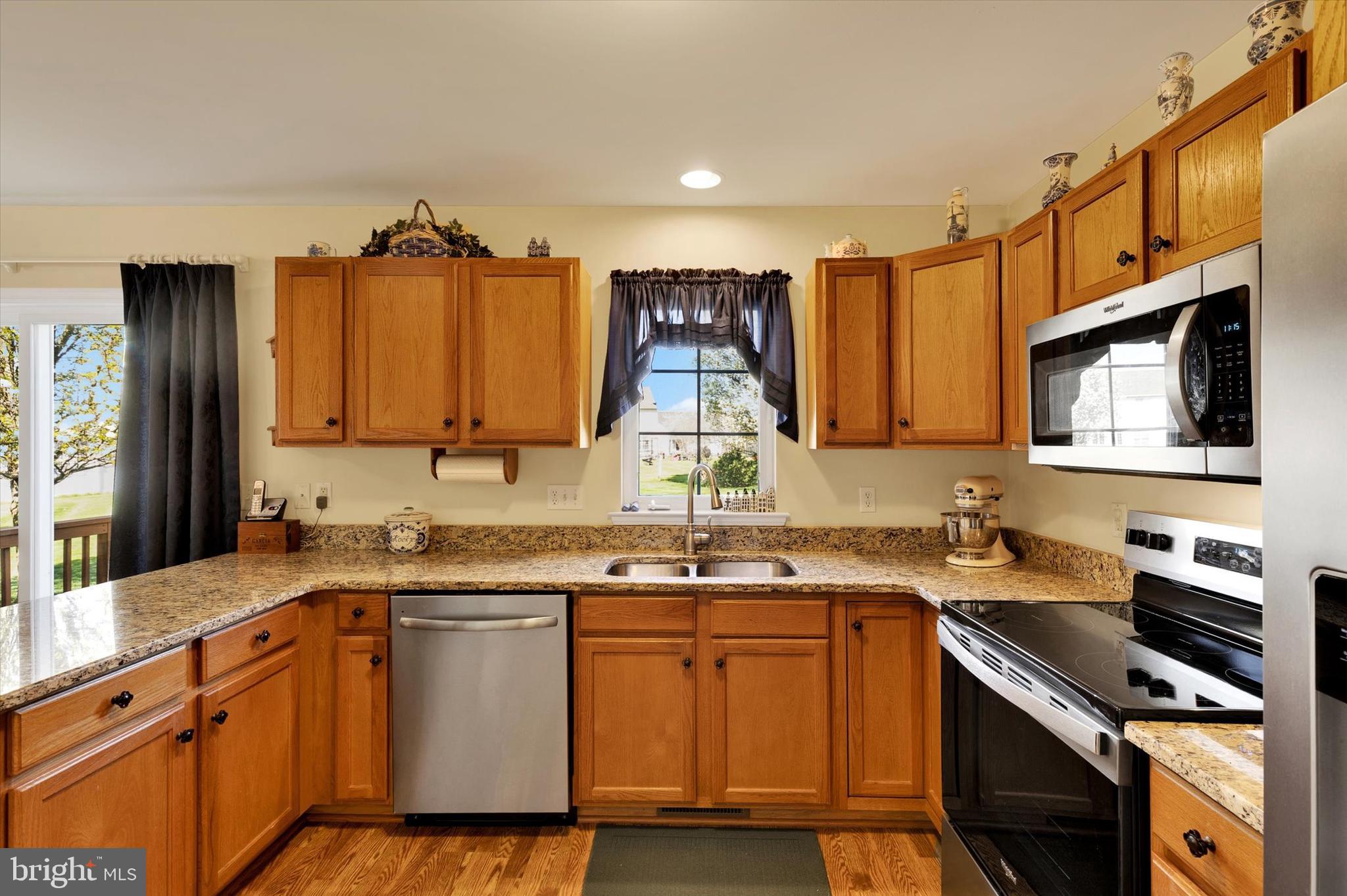 113 Hillcrest Road Marietta, PA 17547 - Photo 14 of 29 a kitchen with stainless steel appliances a sink stove and cabinets