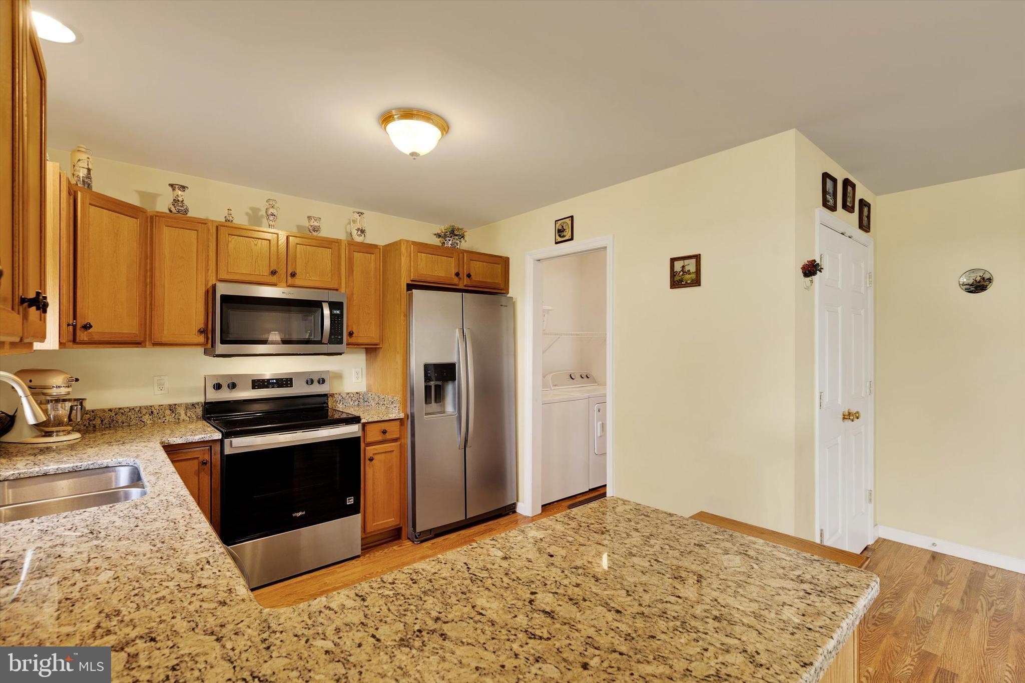 113 Hillcrest Road Marietta, PA 17547 - Photo 15 of 29 a kitchen with stainless steel appliances granite countertop a refrigerator stove and oven