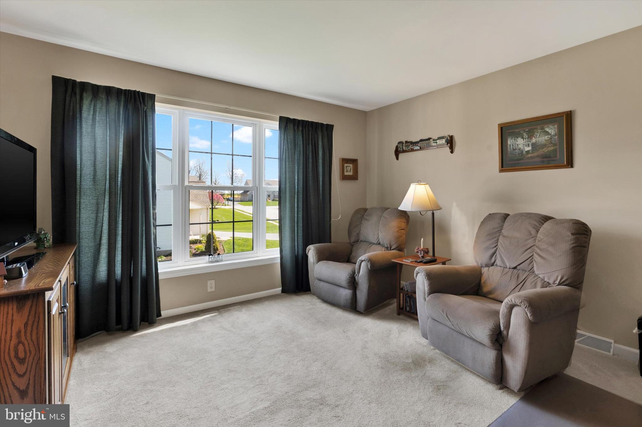 113 Hillcrest Road Marietta, PA 17547 - Photo 17 of 29 a living room with furniture and a flat screen tv