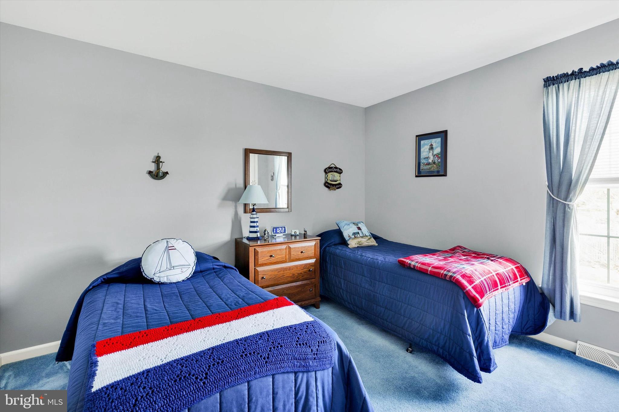 113 Hillcrest Road Marietta, PA 17547 - Photo 24 of 29 a bedroom with a bed and wooden floor