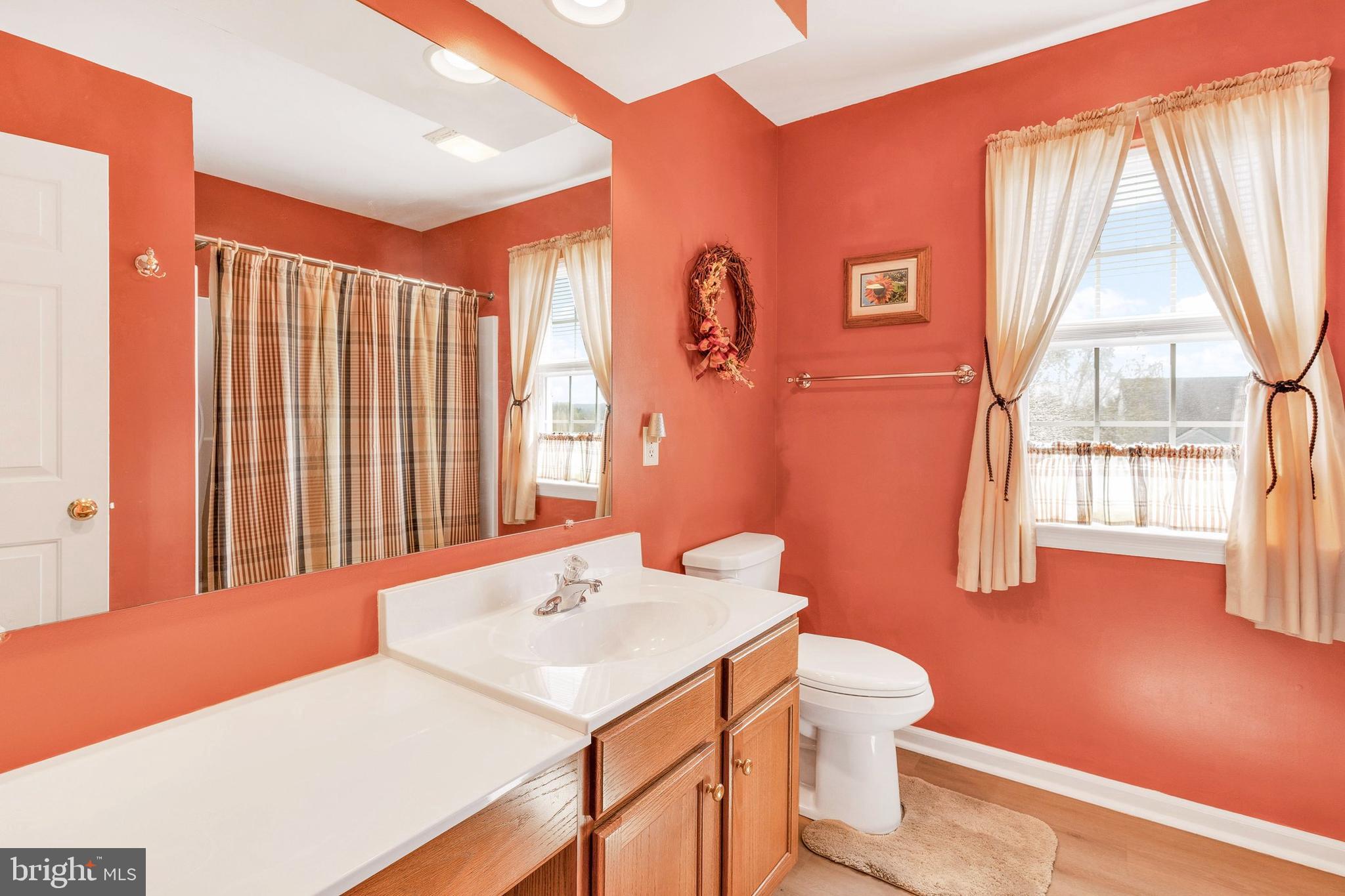 113 Hillcrest Road Marietta, PA 17547 - Photo 25 of 29 a bathroom with a sink a toilet and a window