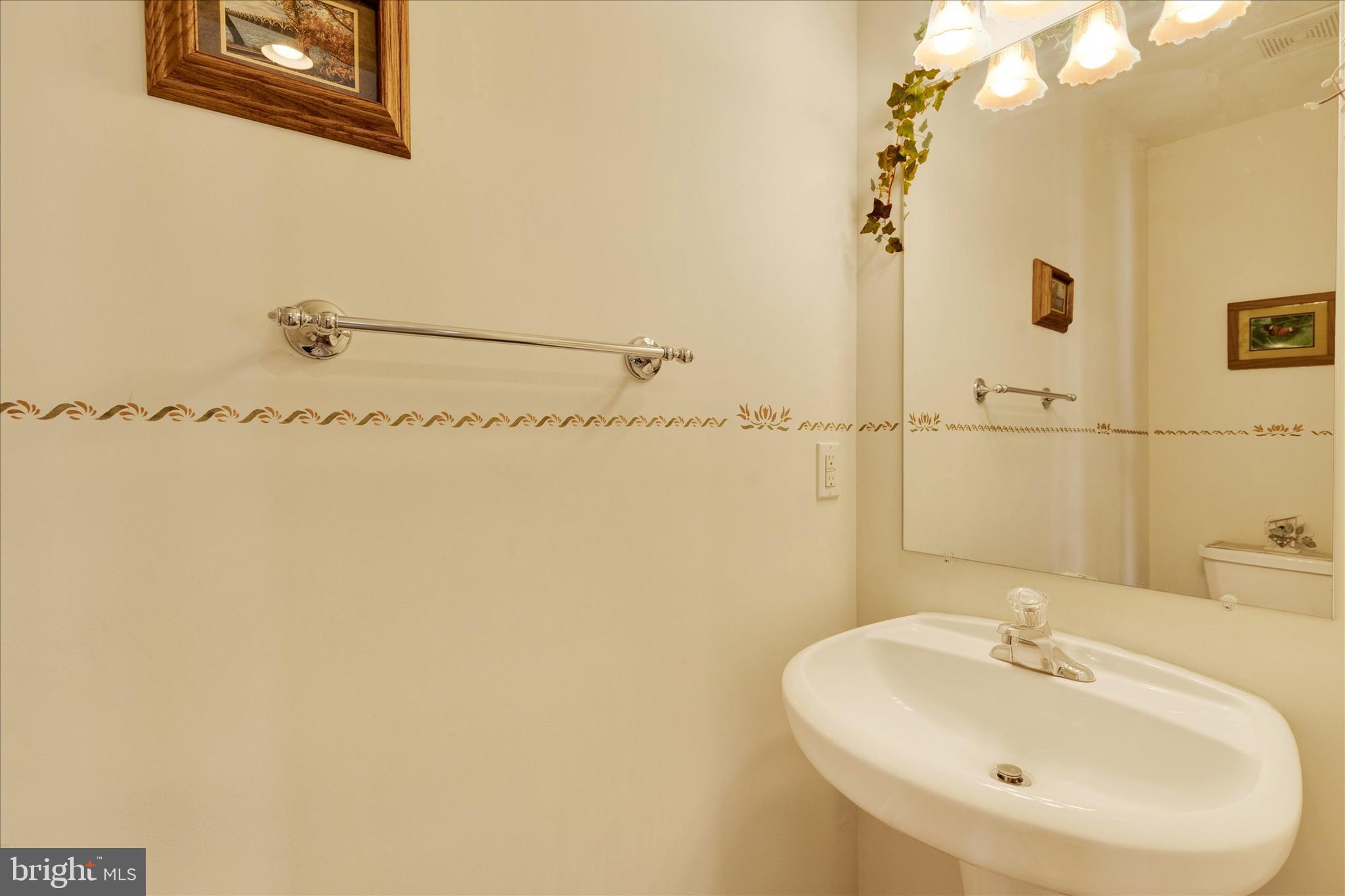 113 Hillcrest Road Marietta, PA 17547 - Photo 7 of 29 a bathroom with a sink a mirror and shower