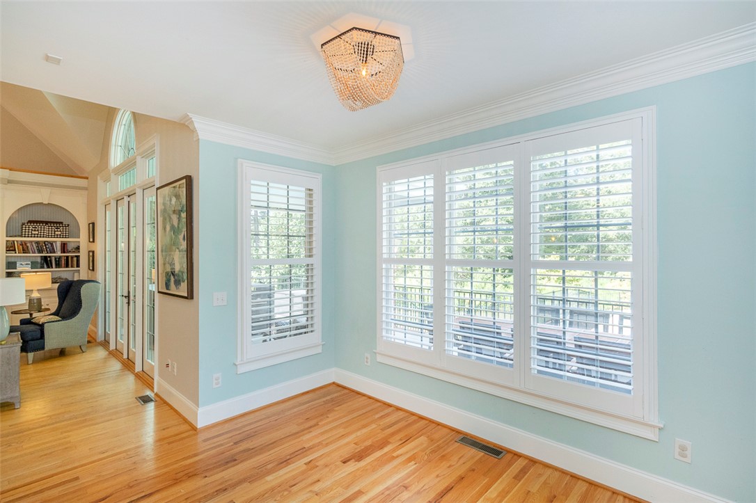 1104 Harpers Way Anderson, SC 29621 - Photo 10 of 50 This airy room features hardwood floors and ample natural light, creating an inviting atmosphere.