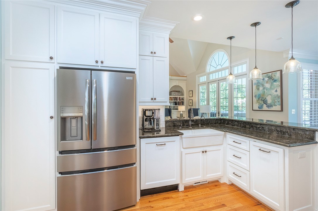 1104 Harpers Way Anderson, SC 29621 - Photo 13 of 50 This spacious kitchen offers a seamless blend of modern amenities and classic design with beautiful hardwood floors.