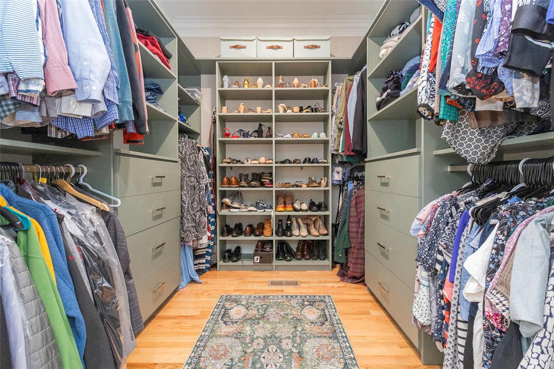 1104 Harpers Way Anderson, SC 29621 - Photo 18 of 50 This spacious walk-in closet offers ample storage with built-in shelving and hardwood flooring.