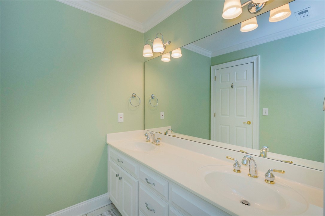 1104 Harpers Way Anderson, SC 29621 - Photo 26 of 50 This bathroom features a double vanity with ample counter space and a large mirror.