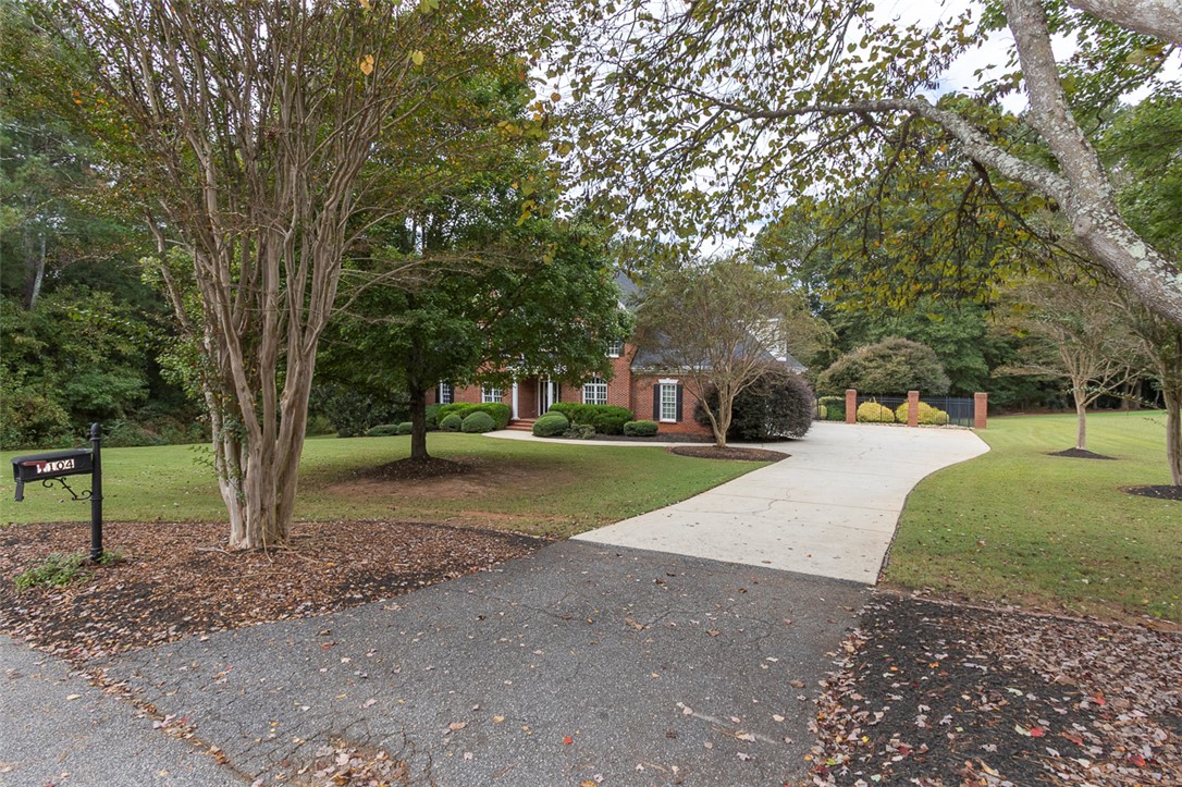 1104 Harpers Way Anderson, SC 29621 - Photo 46 of 50 This charming home features a classic brick exterior and a welcoming circular driveway.