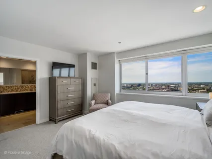 a bathroom with a sink a toilet a mirror and vanity