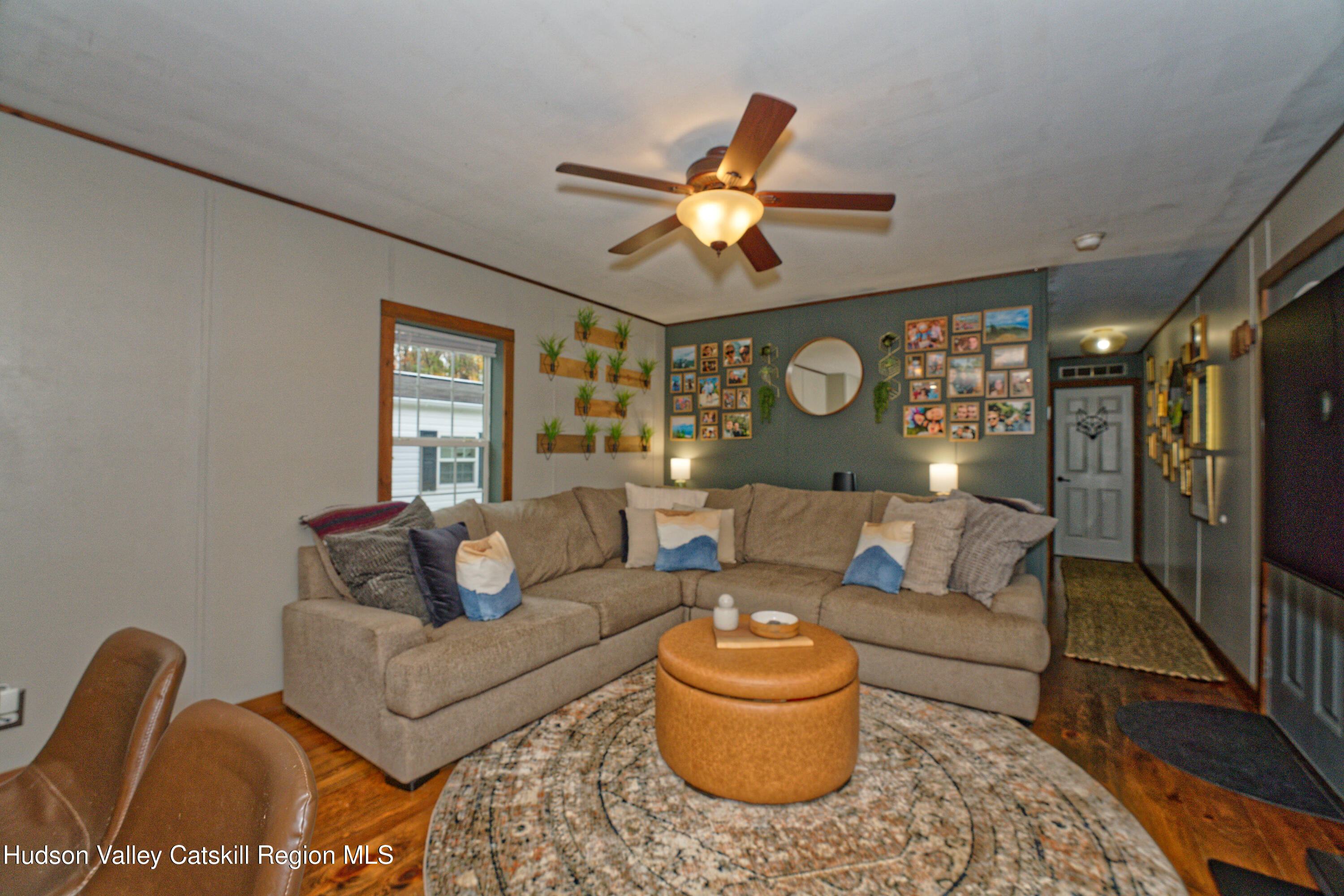 28 Matthew Drive, Unit 28 Castleton-on-Hudson, NY 12033 - Photo 11 of 28 a living room with furniture and a large window