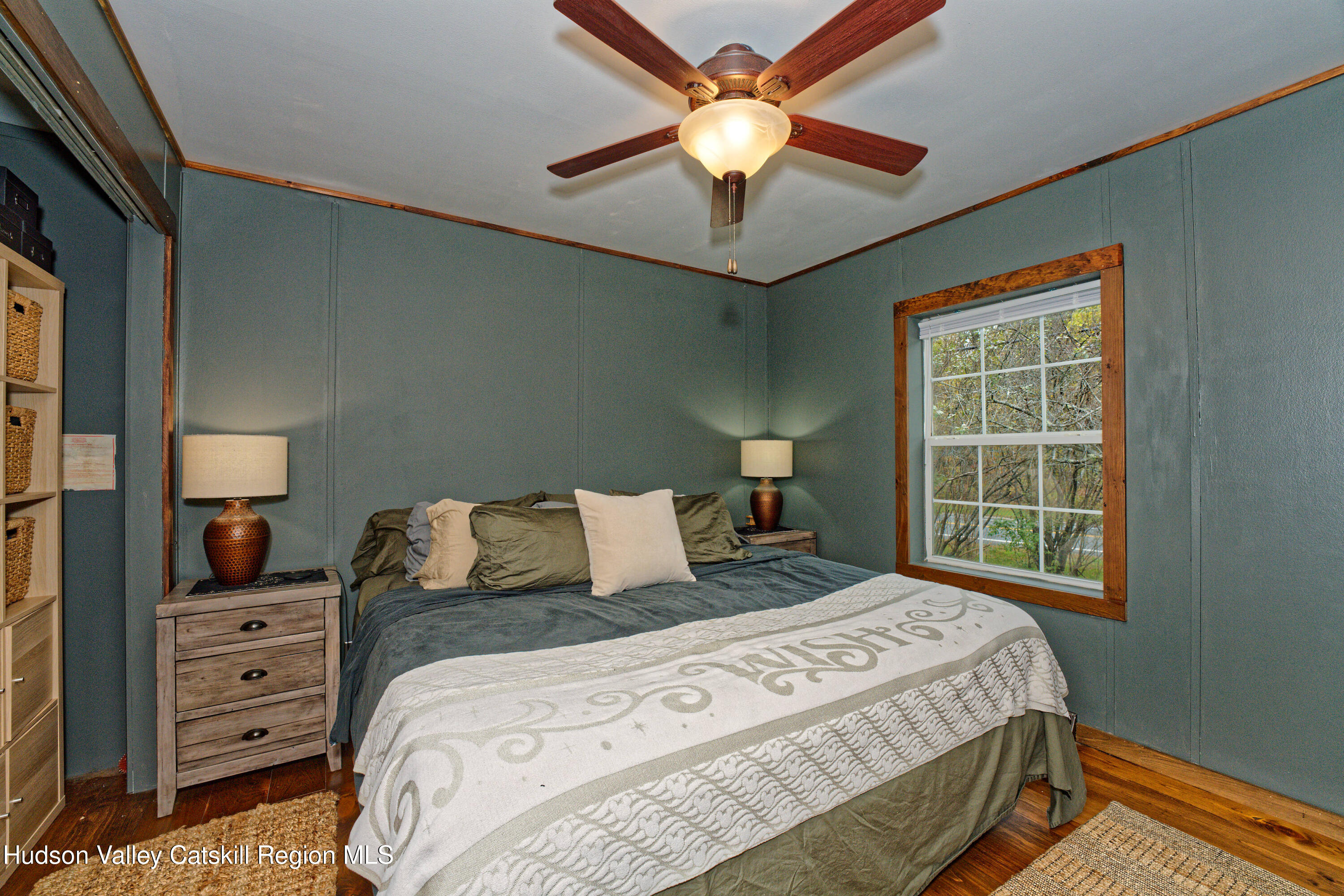 28 Matthew Drive, Unit 28 Castleton-on-Hudson, NY 12033 - Photo 13 of 28 a bedroom with a bed and a chandelier