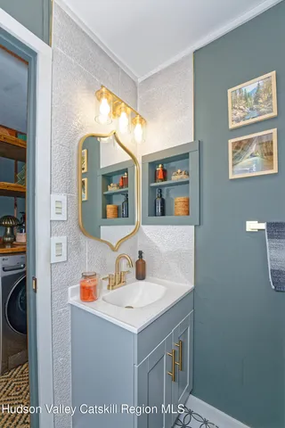 a bathroom with a sink and a mirror