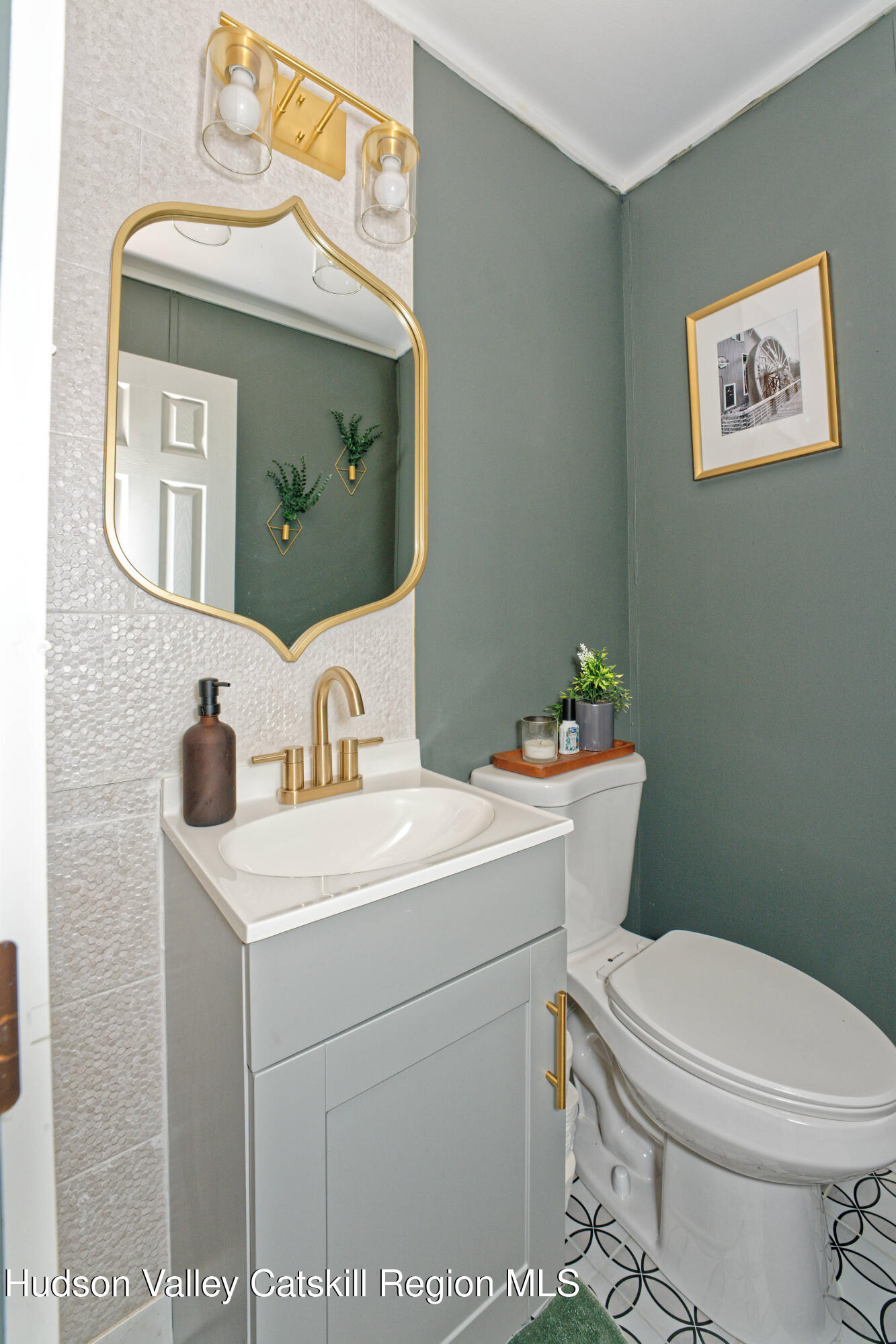 28 Matthew Drive, Unit 28 Castleton-on-Hudson, NY 12033 - Photo 19 of 28 a bathroom with a toilet a sink and a mirror