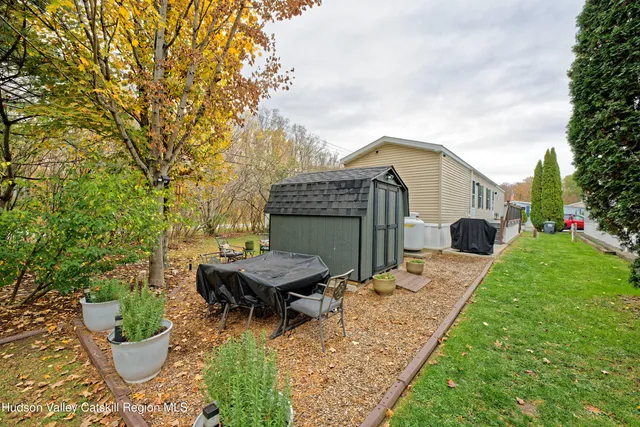 a backyard of a house with seating space
