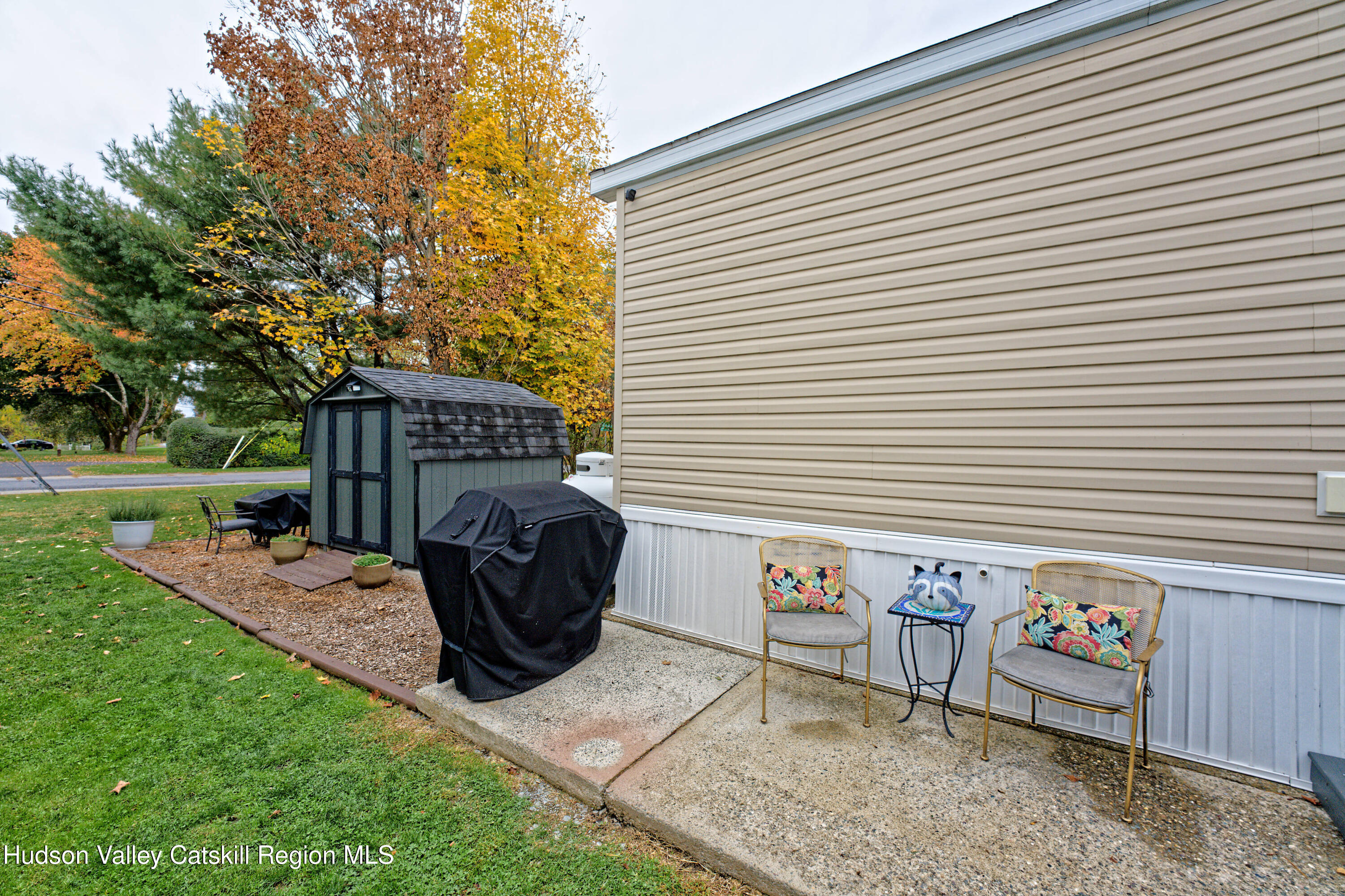 28 Matthew Drive, Unit 28 Castleton-on-Hudson, NY 12033 - Photo 25 of 28 a view of a chairs and table in backyard of the house