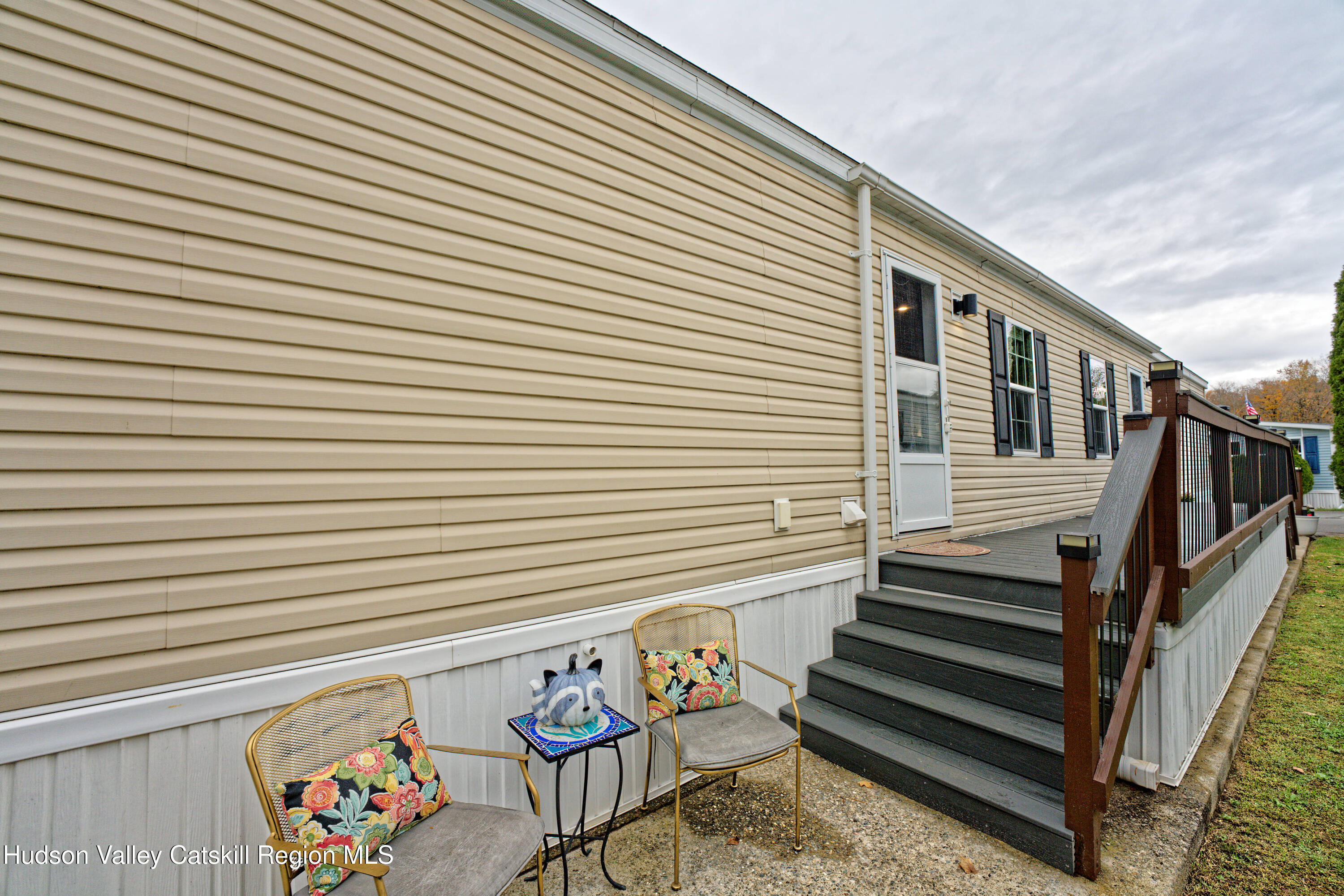 28 Matthew Drive, Unit 28 Castleton-on-Hudson, NY 12033 - Photo 28 of 28 a view of a patio with wooden chairs