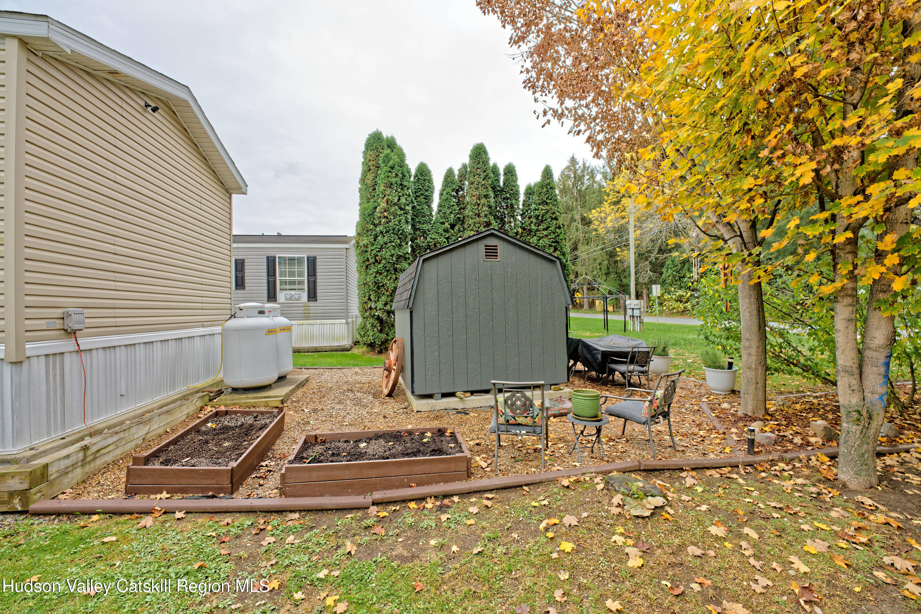 28 Matthew Drive, Unit 28 Castleton-on-Hudson, NY 12033 - Photo 3 of 28 a view of a backyard with sitting area