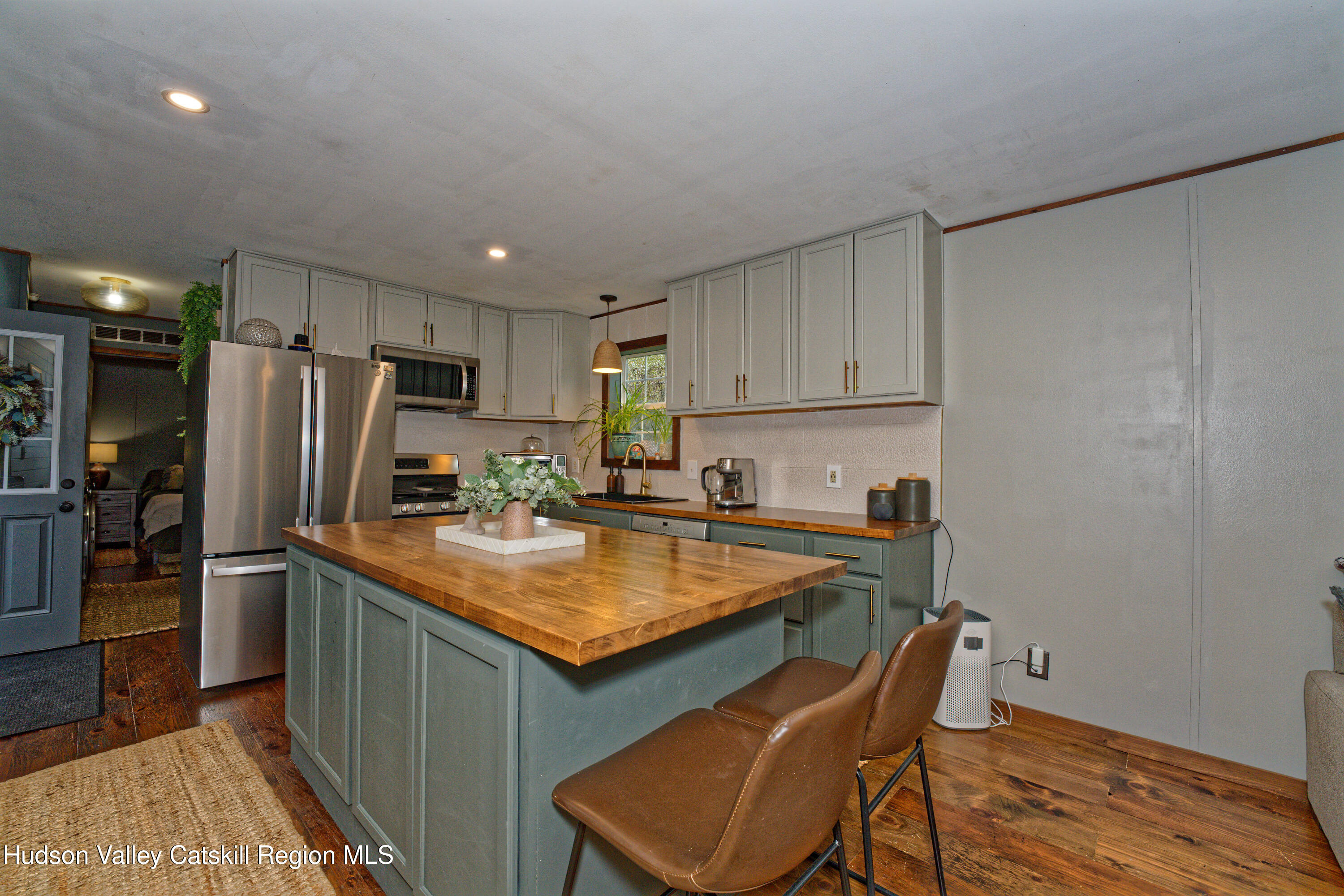 28 Matthew Drive, Unit 28 Castleton-on-Hudson, NY 12033 - Photo 5 of 28 a kitchen with stainless steel appliances granite countertop a refrigerator and a stove top oven