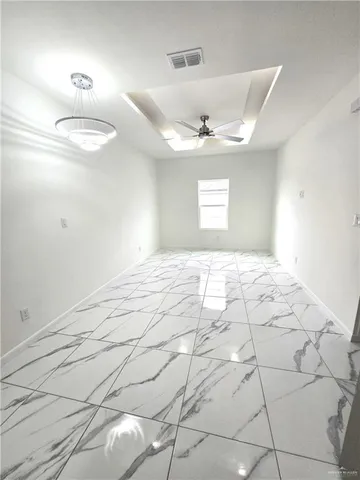 a view of empty room with windows