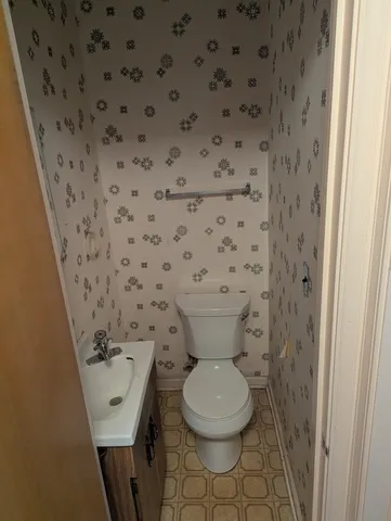 a bathroom with a toilet and a sink