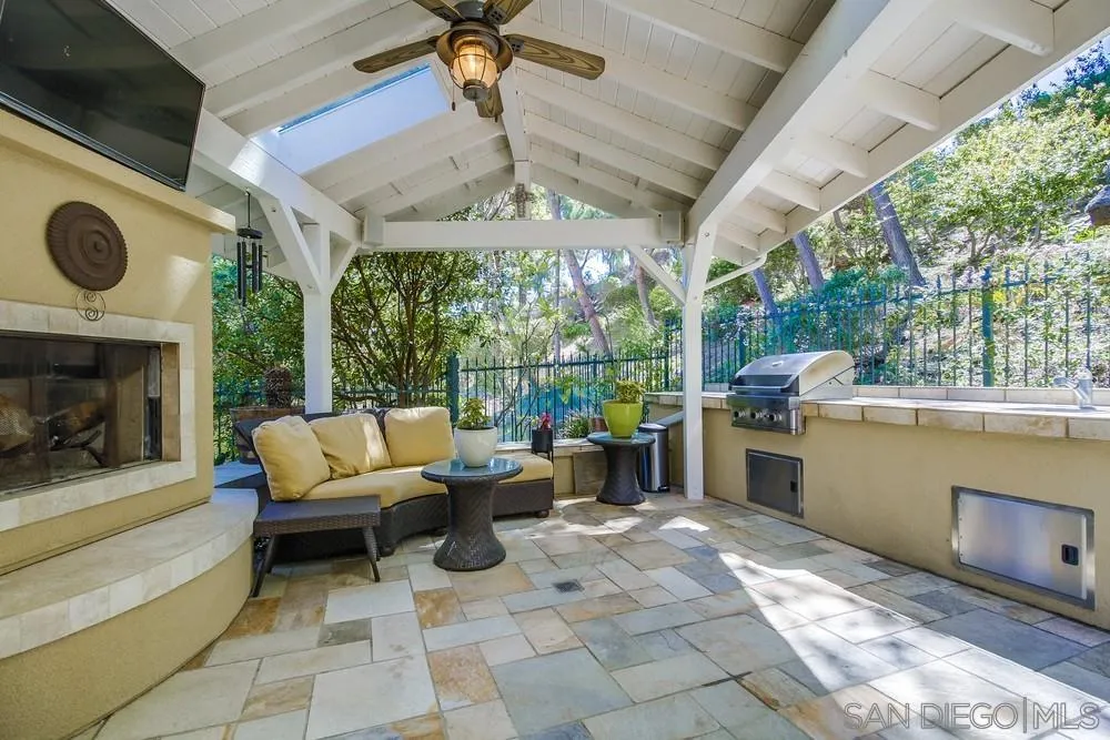 2305 Falkirk Row La Jolla, CA 92037 - Photo 21 of 36 a view of a patio with a tv dining table and chairs