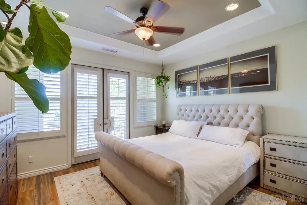 2305 Falkirk Row La Jolla, CA 92037 - Photo 30 of 36 a bedroom with a large bed and a window