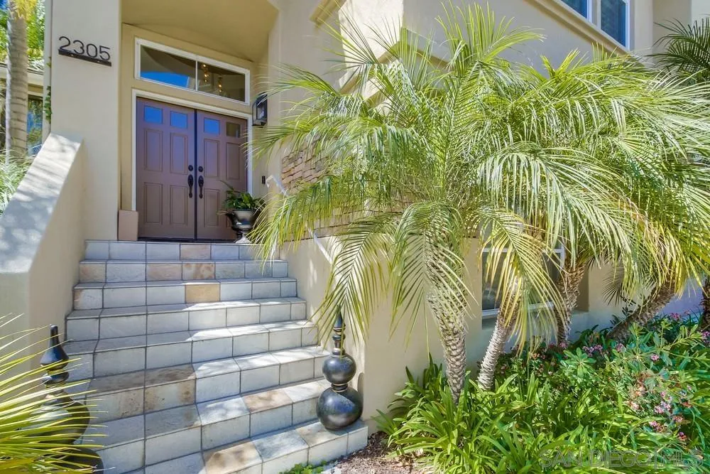 2305 Falkirk Row La Jolla, CA 92037 - Photo 3 of 36 a view of brick house with a yard