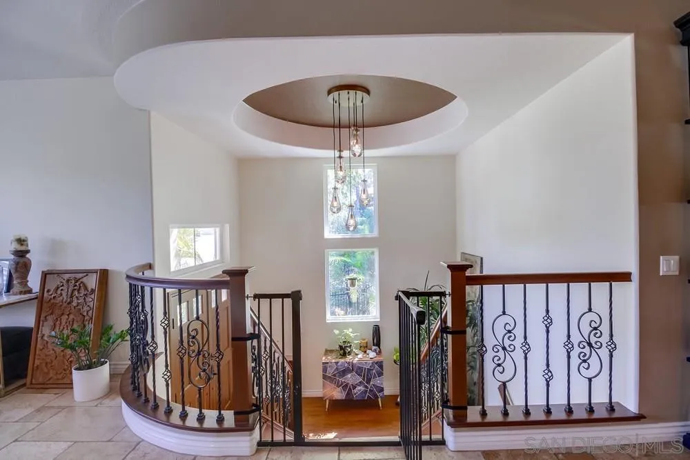2305 Falkirk Row La Jolla, CA 92037 - Photo 4 of 36 a view of a hallway with wooden floor and entryway