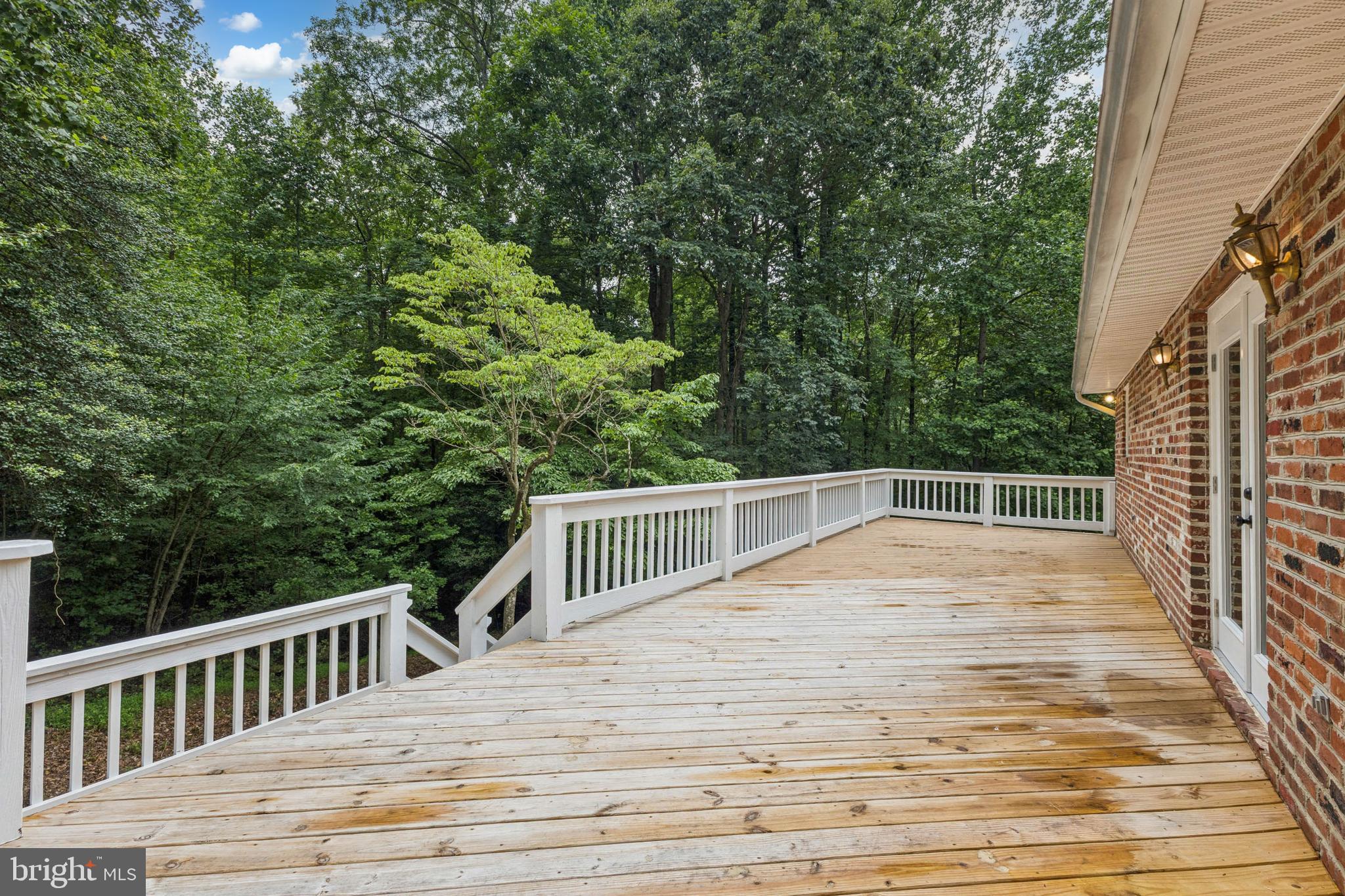 10664 Deacon Road White Plains, MD 20695 - Photo 41 of 50 Deck with Stairs to Lower Grounds