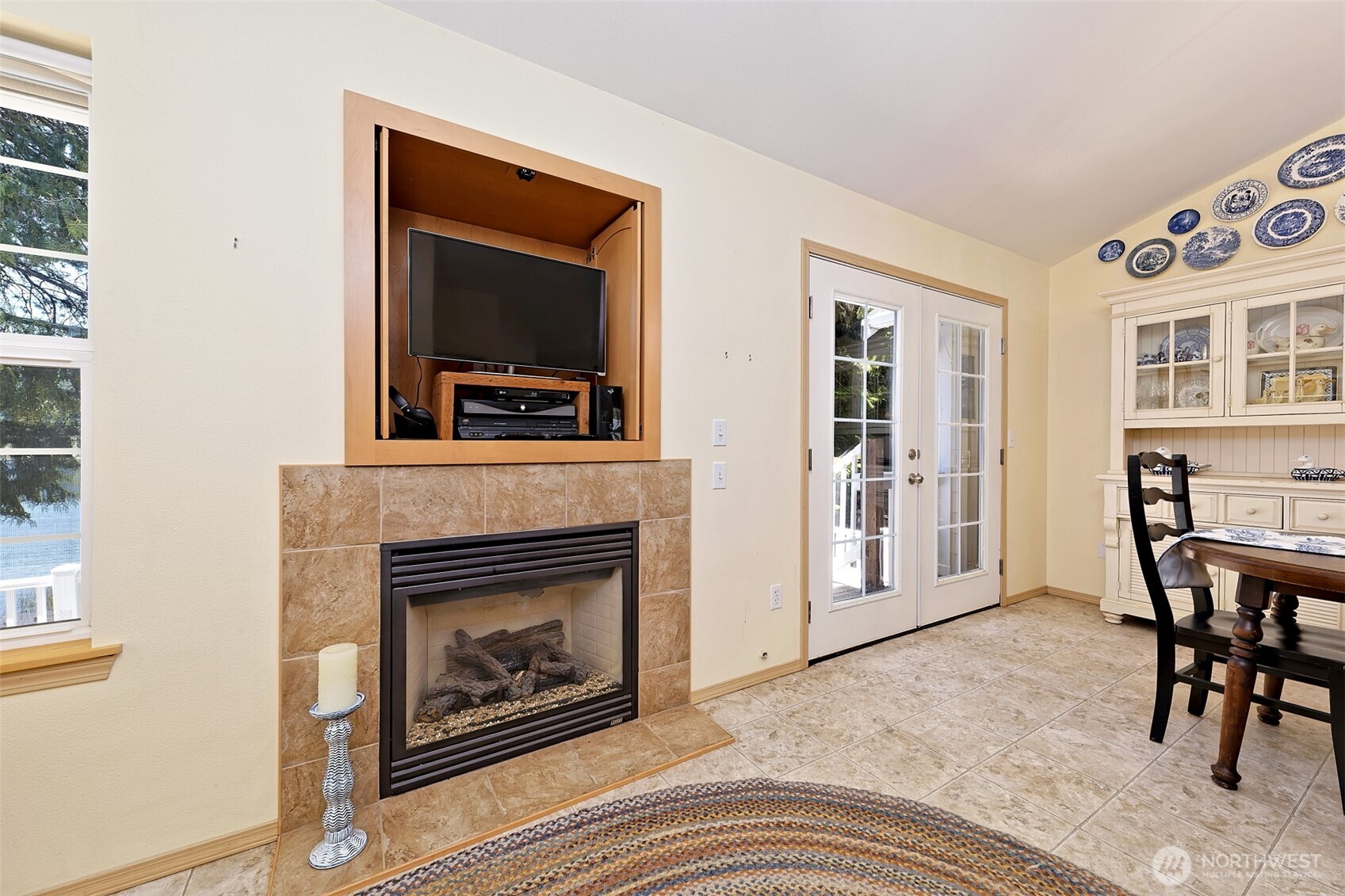 1091 E Trail Belfair, WA 98528 - Photo 15 of 31 a living room with furniture and a fireplace