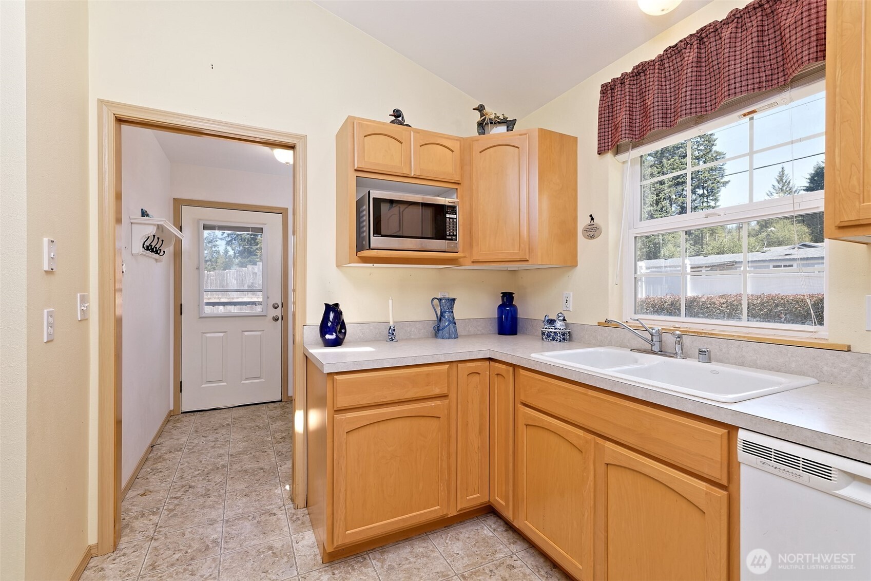 1091 E Trail Belfair, WA 98528 - Photo 17 of 31 a kitchen that has a sink and a stove