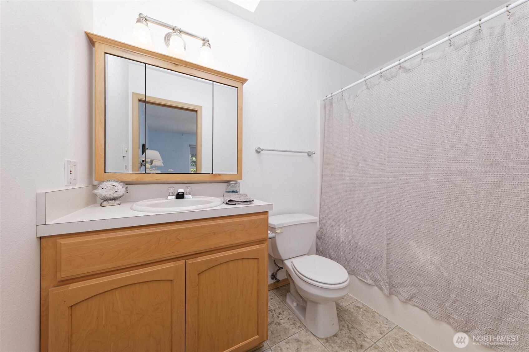 1091 E Trail Belfair, WA 98528 - Photo 21 of 31 a bathroom with a toilet sink and mirror