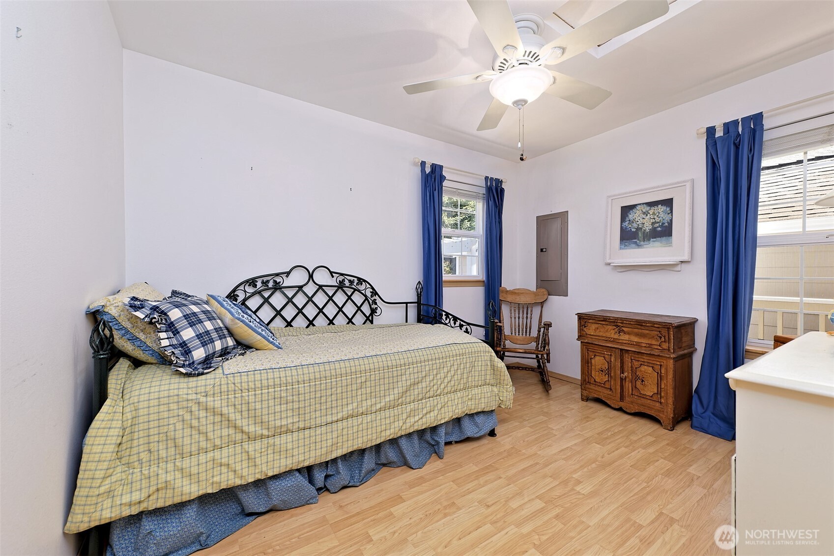 1091 E Trail Belfair, WA 98528 - Photo 22 of 31 a bedroom with a bed and wooden floor