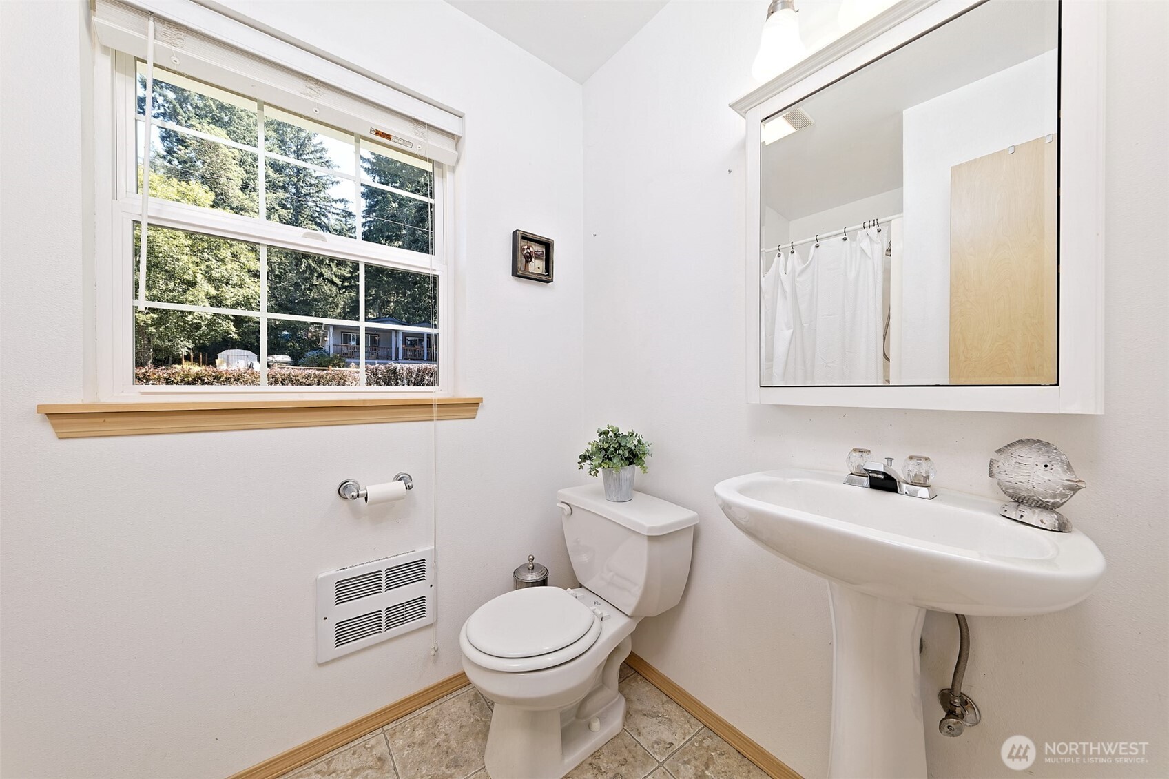 1091 E Trail Belfair, WA 98528 - Photo 23 of 31 a bathroom with a sink toilet and a mirror